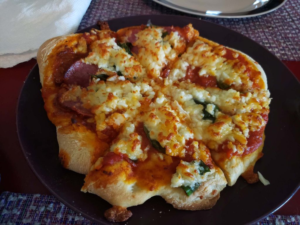 Salami and basil pizza