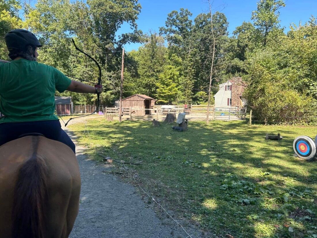 An archer on a horse drawing arrow
