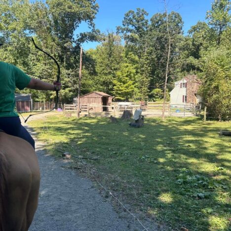 An archer on a horse drawing arrow
